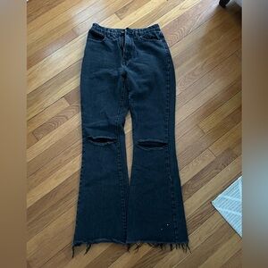 Pretty Little Thing Black Bootcut jeans with rips in knees